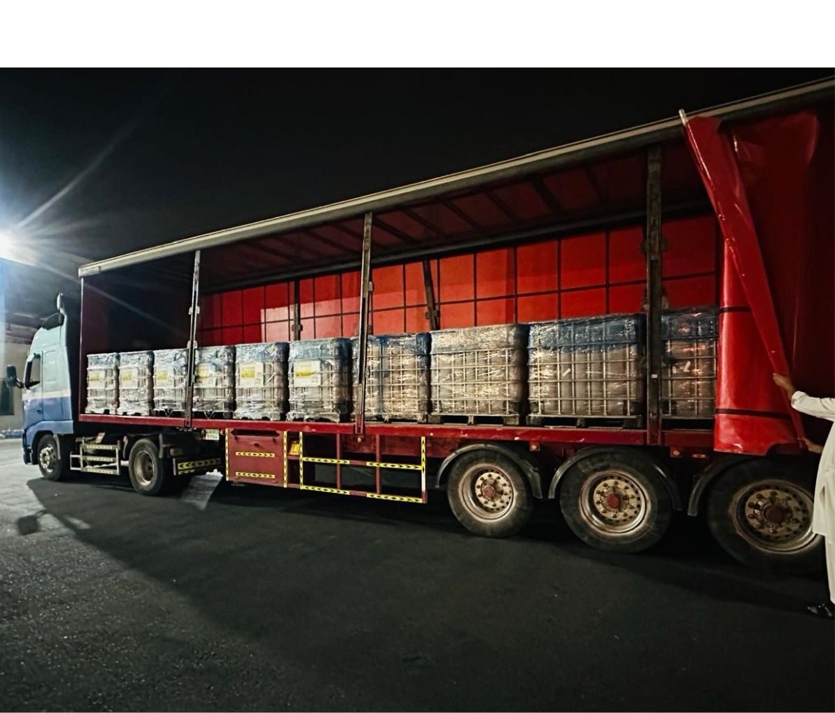 Priority transit loaded under red curtain-side trailer
