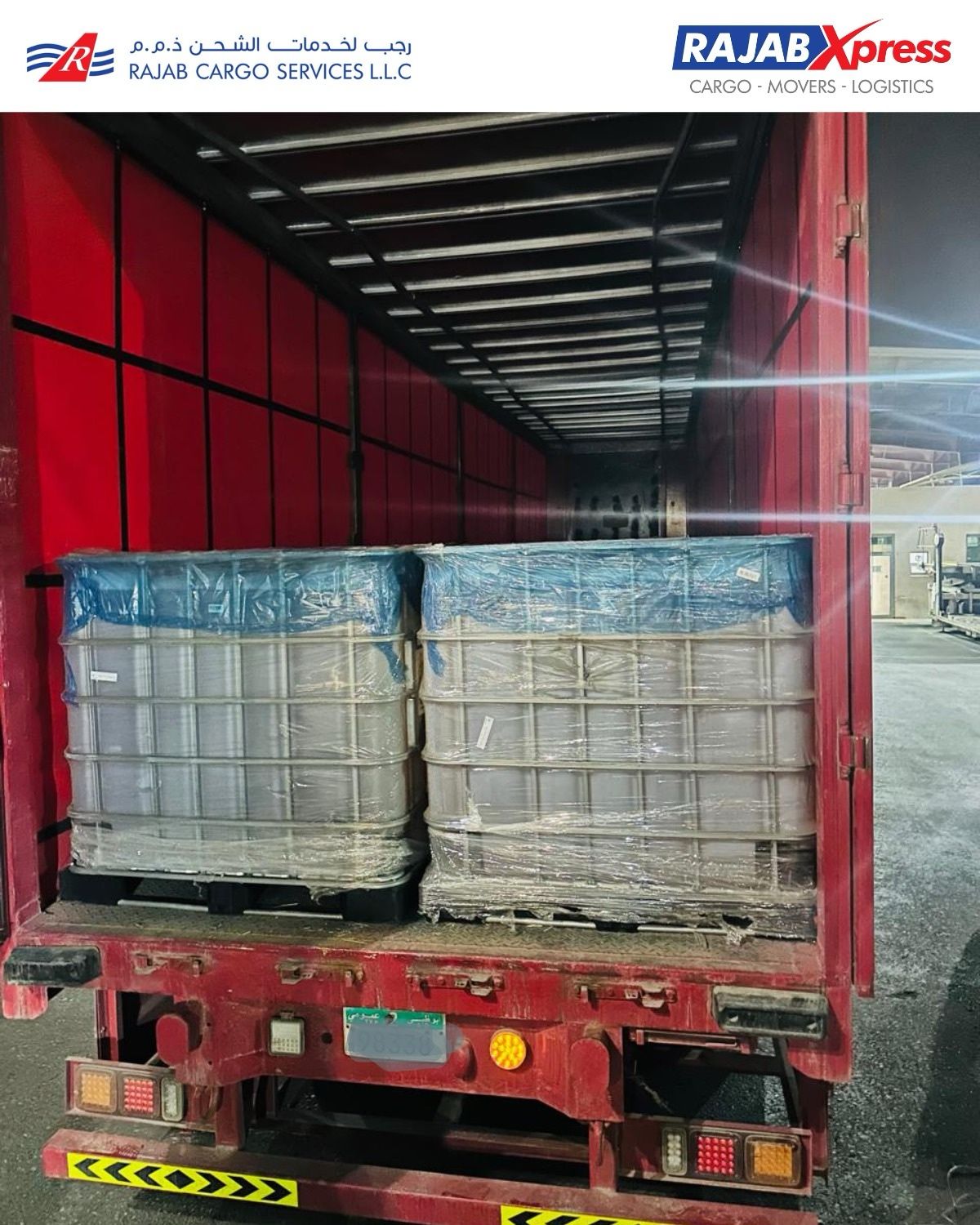 IBC totes loaded and secured in a curtain-side trailer for road transit
